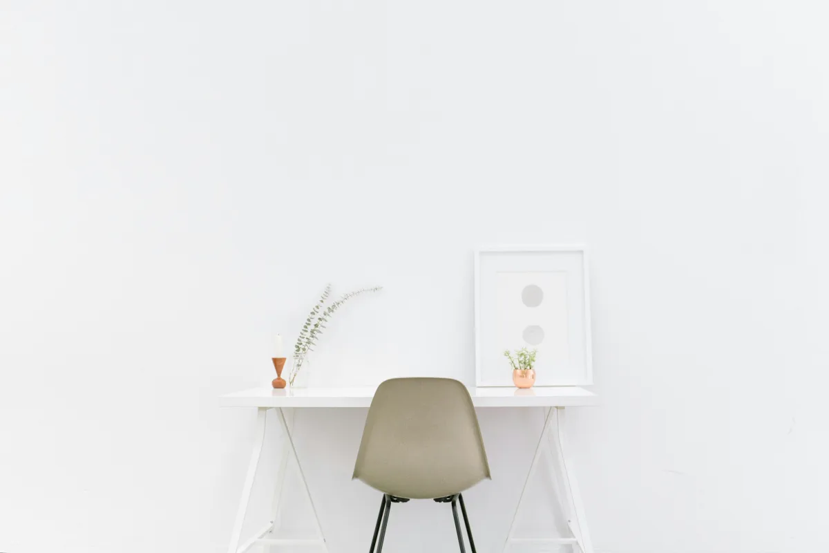 white wooden table near brown chair